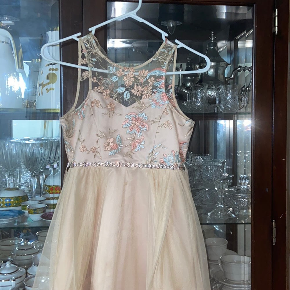 Worn only twice ,formal beige dress ,pretty rhinestoned belt attached to it.